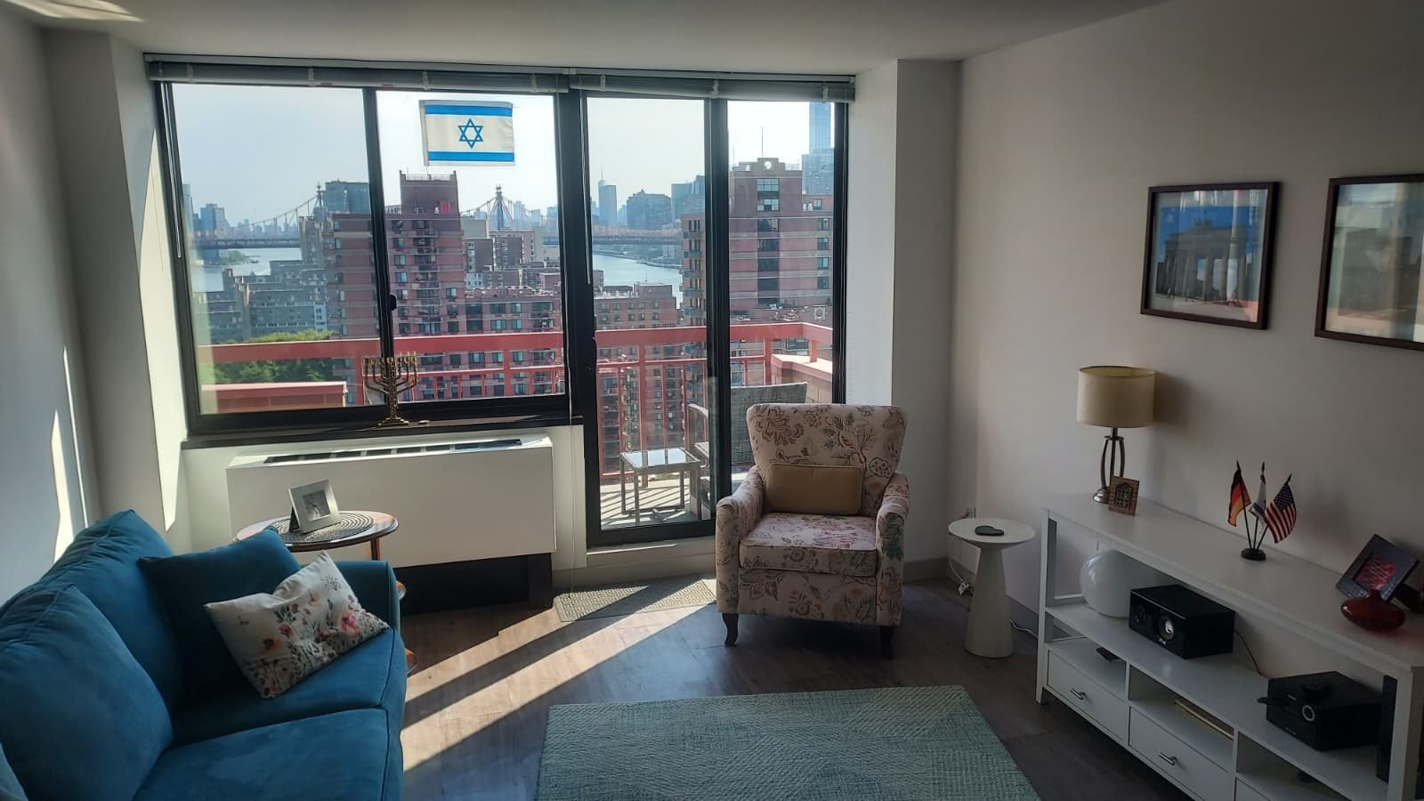Interior of the New York prayer apartment with the skyline visible through the windows